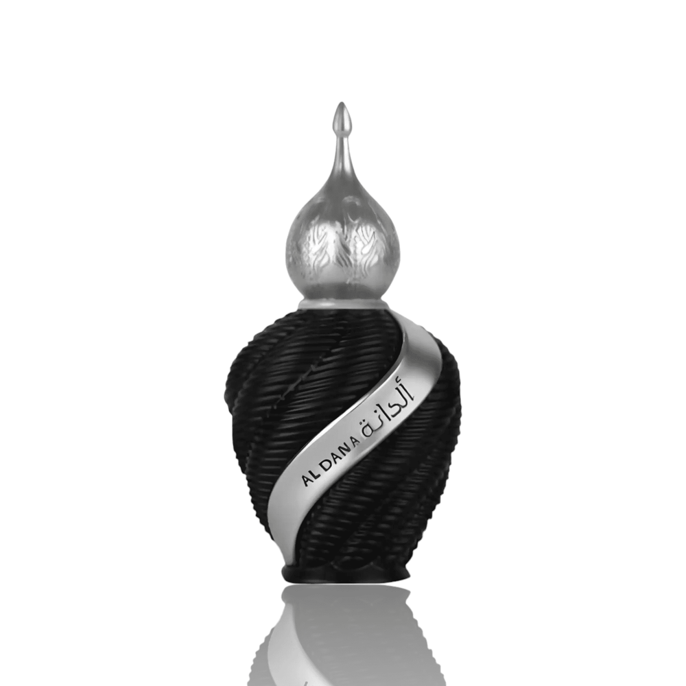 Close-up of Al Dana perfume bottle, highlighting its luxurious design and the rich combination of bergamot, jasmine, and musk.