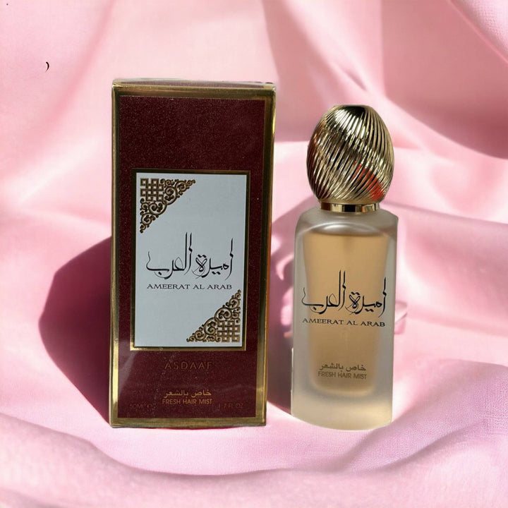 Ameerat Al Arab Fresh Hair Mist against a backdrop of jasmine and lily flowers, reflecting its floral heart notes.