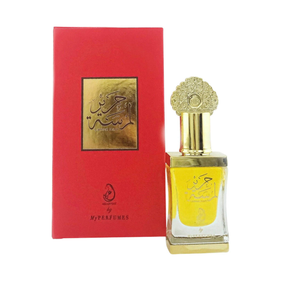 Elegant drop of Lamsat Harir Perfume Oil, capturing the essence of its intoxicating aroma.