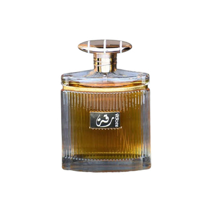 Detailed image of the Riqqa perfume bottle, focusing on the sophisticated design and the golden hue of the fragrance, symbolizing its rich and inviting aroma.
