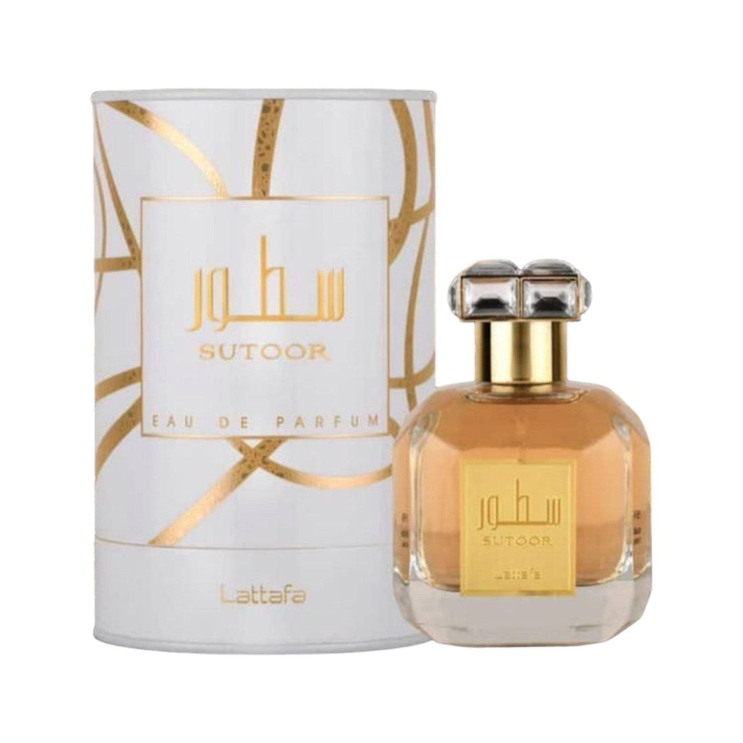 Luxurious Sutoor Perfume bottle by Lattafa, showcasing its rich amber hue, set against a backdrop of tropical elegance