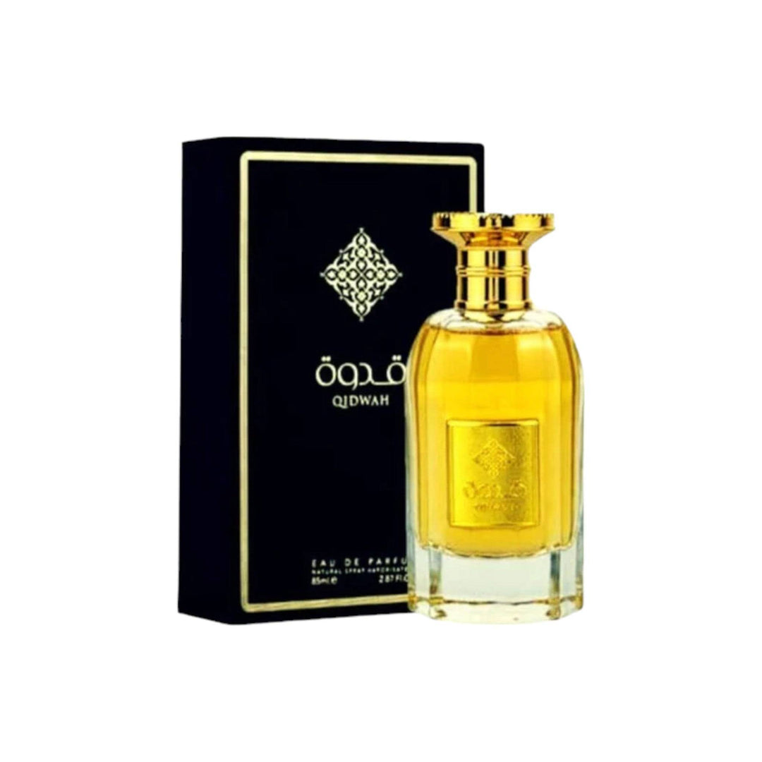 Qidwah perfume positioned amidst a cascade of its key ingredients - orange, lemon, and a bouquet of jasmine and roses, with a hint of vanilla and sandalwood, illustrating the scent's complex character.