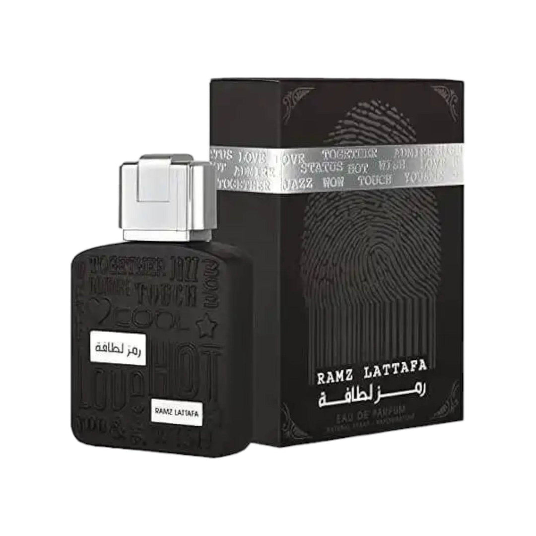 Elegant bottle of Ramz Lattafa Silver Eau De Parfum showcasing its luxurious design.